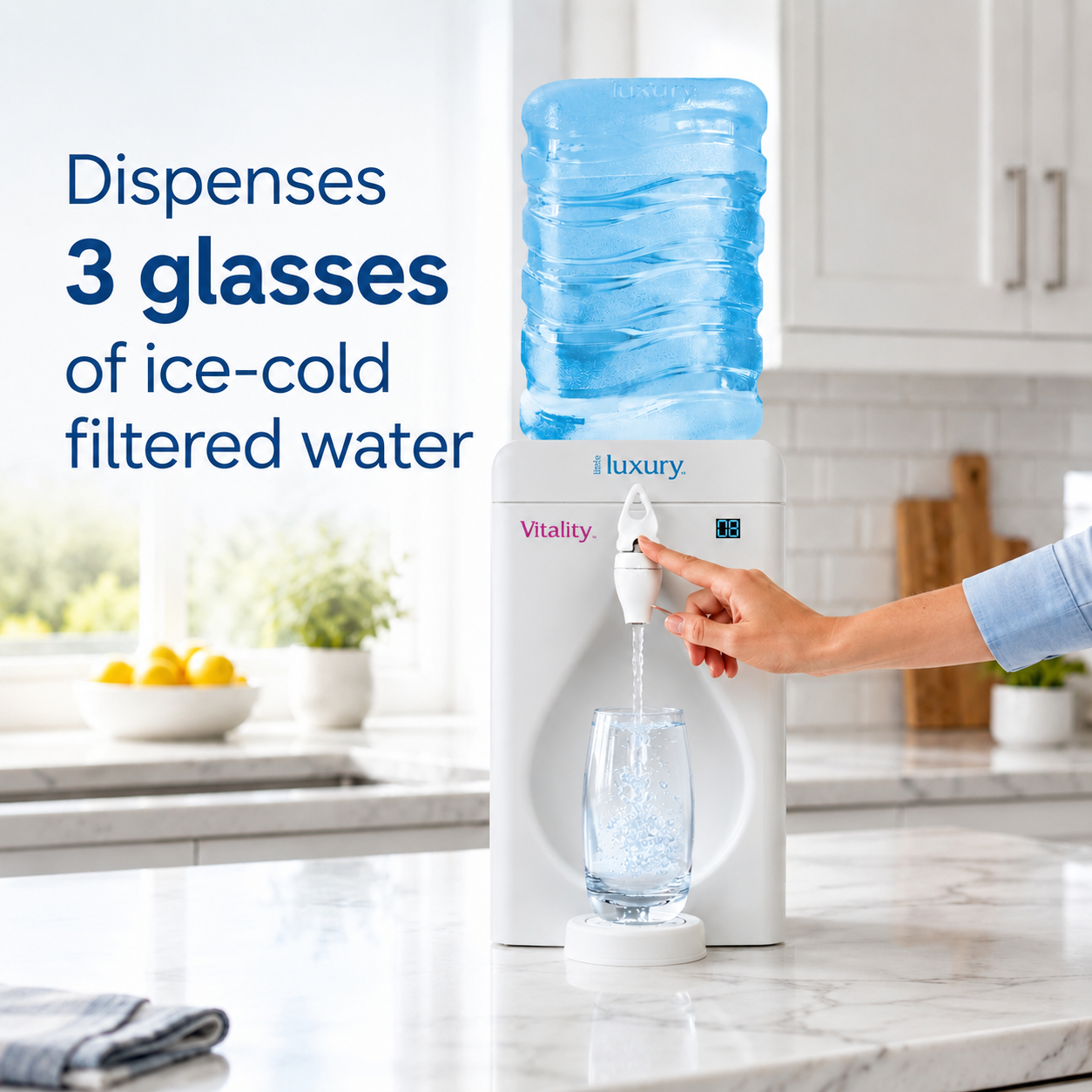 Little Luxury Vitality water cooler dispensing ice-cold filtered water into a glass